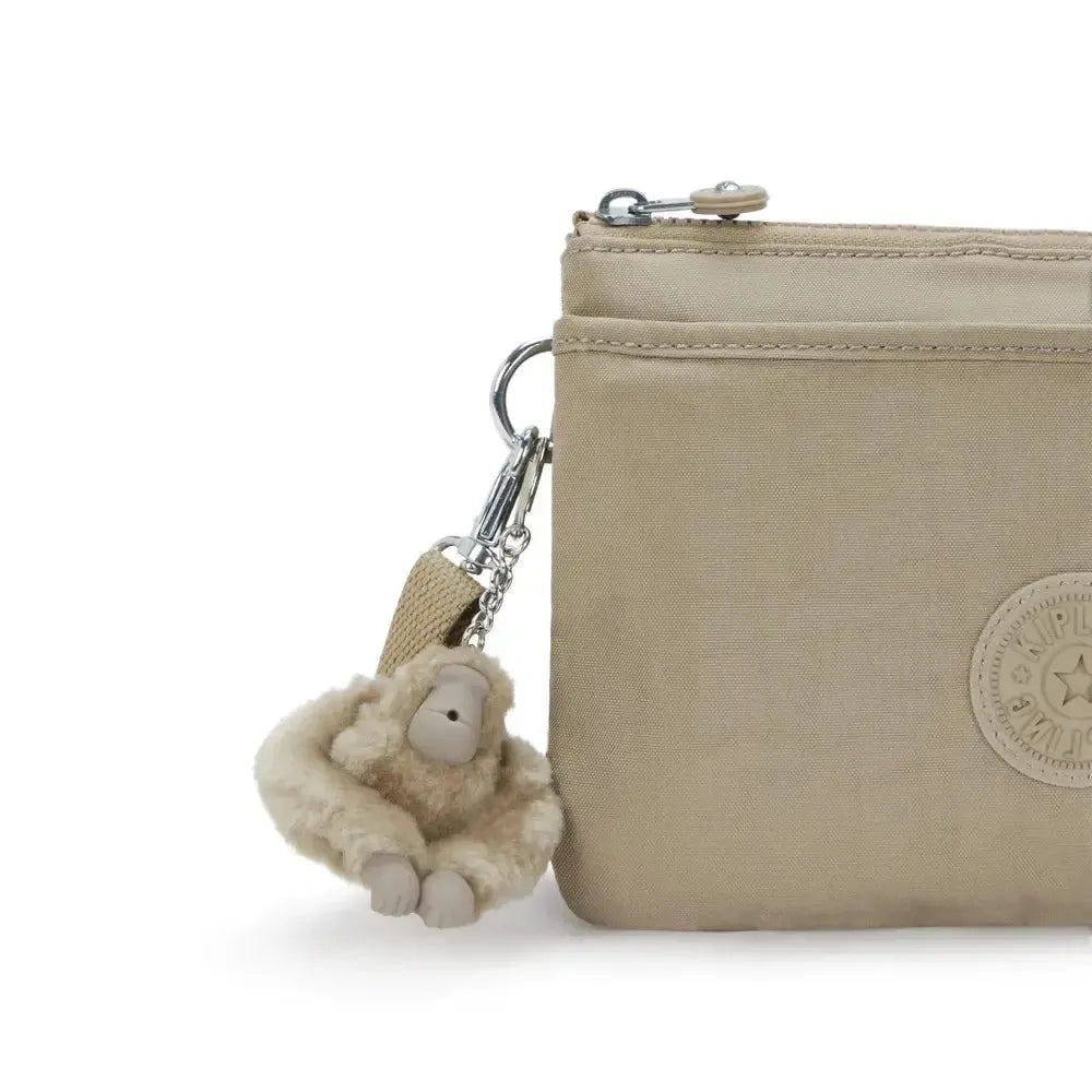 Kipling RIRI crossbody-veske Soft Taupe-Veske-BagBrokers
